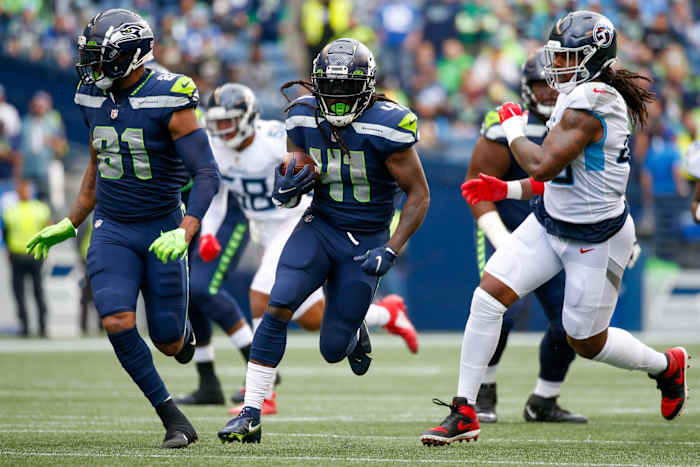 Seattle Seahawks running back Alex Collins (41) runs against Tennessee Titans linebacker Bud Dupree (48). Mandatory Credit: Joe Nicholson-USA TODAY Sports